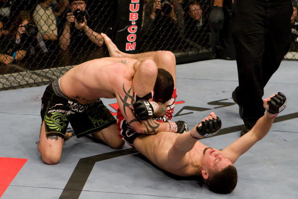 BROOMFIELD, CO - APRIL 2: Nate Diaz (red/black shorts) def. Kurt Pellegrino (black shorts) - submission (triangle choke) - 3:06 round 2 during the UFC Fight Night 13 at the Broomfield Event Center on April 2, 2008 in Broomfield, Colorado. (Photo by Josh Hedges/Zuffa LLC via Getty Images)