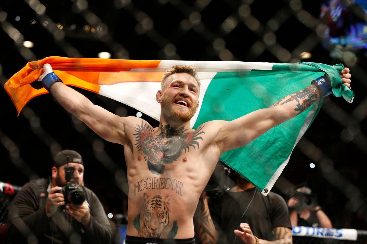 Conor McGregor reacts after defeating Jose Aldo during a featherweight championship mixed martial arts bout at UFC 194, Saturday, Dec. 12, 2015, in Las Vegas. (AP Photo/John Locher)